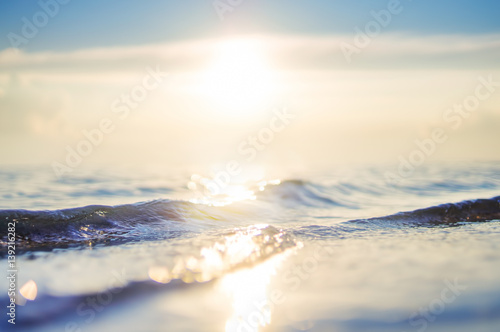 Fototapeta Naklejka Na Ścianę i Meble -   sea wave and sky at sunset. blurred background