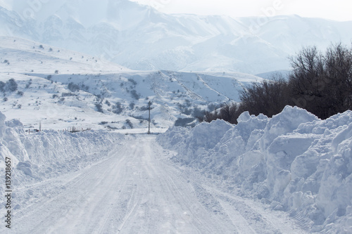 snowy road in the mountains photo