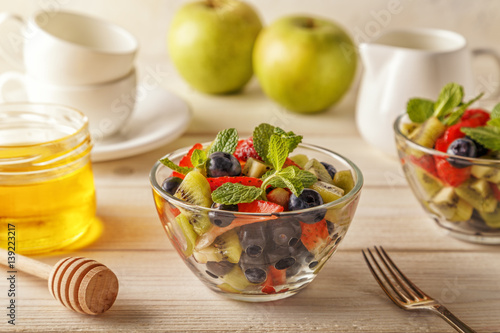 Healthy homemade fruit salad with honey.