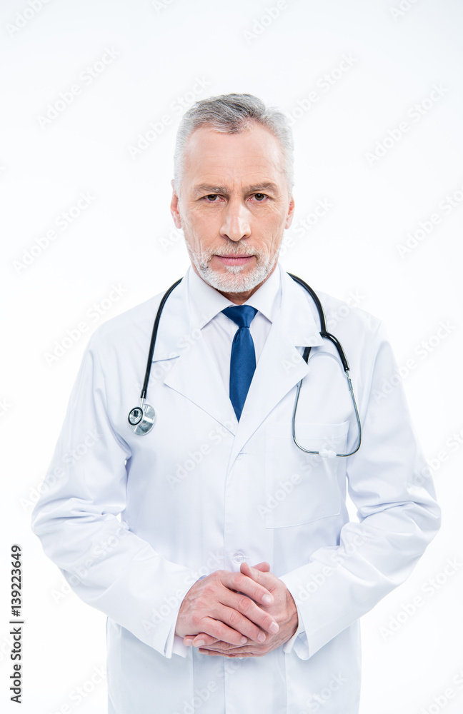 Mature doctor with stethoscope Mature doctor with stethoscope