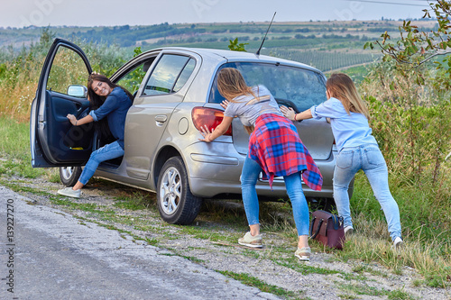 pushing broken down old car