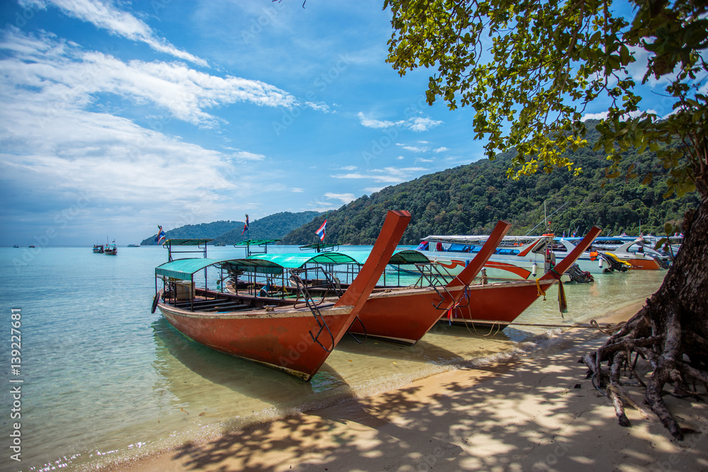 Tourist long tail boat on the beach at Surin island, Thailand