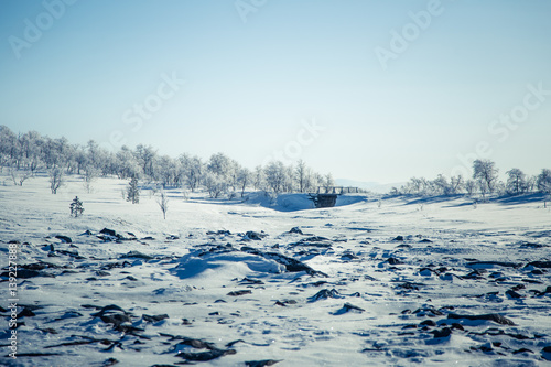 A beautiful landscape with a frozen river in the Norwegian winter