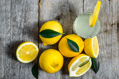 Glass of lemon juice with water - lemonade, detox drink, overhea photo