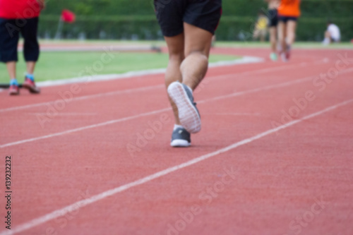 blurred - people running - Walking on a running track - Use For fitness or competition.