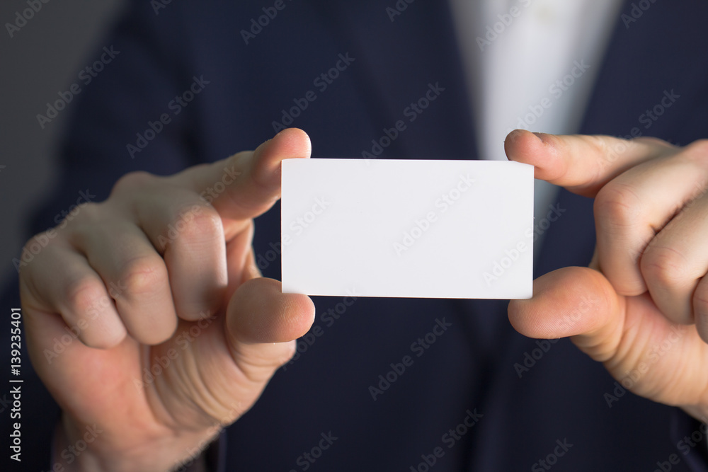 businessman holding blank visit card businessman holding blank visit card