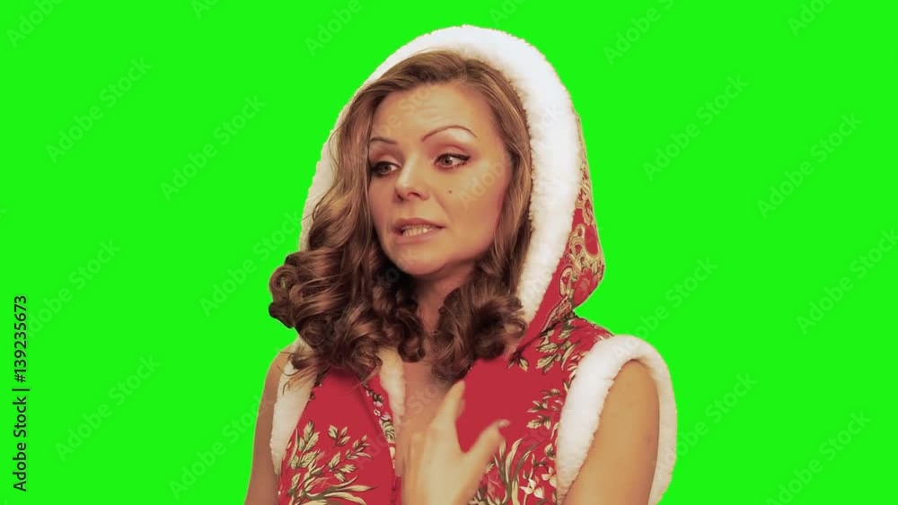 Woman with curly hair wearing christmas costume , foregts words, stops and talks against chromakey. Woman with curly hair wearing christmas costume , foregts words, stops and talks against chromakey.
