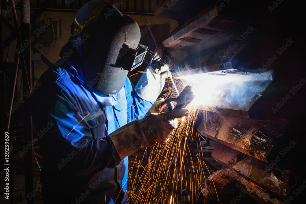Welding steel structures and bright sparks in construction industry. Welding steel structures and bright sparks in construction industry.