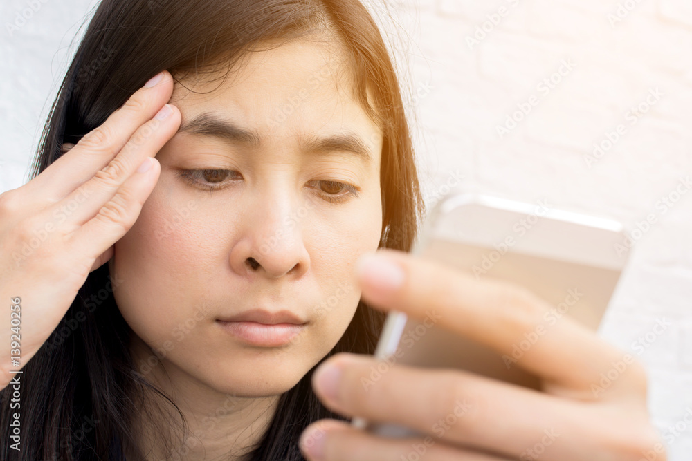 young asian woman internet on mobile phone during rest in coffee shop young asian woman internet on mobile phone during rest in coffee shop