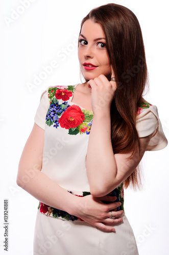 Ukrainian girl wearing national embroidered shirt isolated on white
