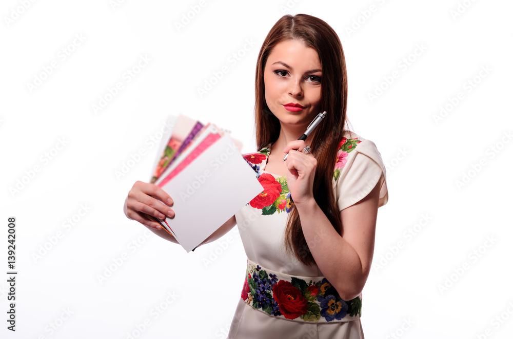 Sparkling businesswoman holding a notebook isolated on a white background Sparkling businesswoman holding a notebook isolated on a white background