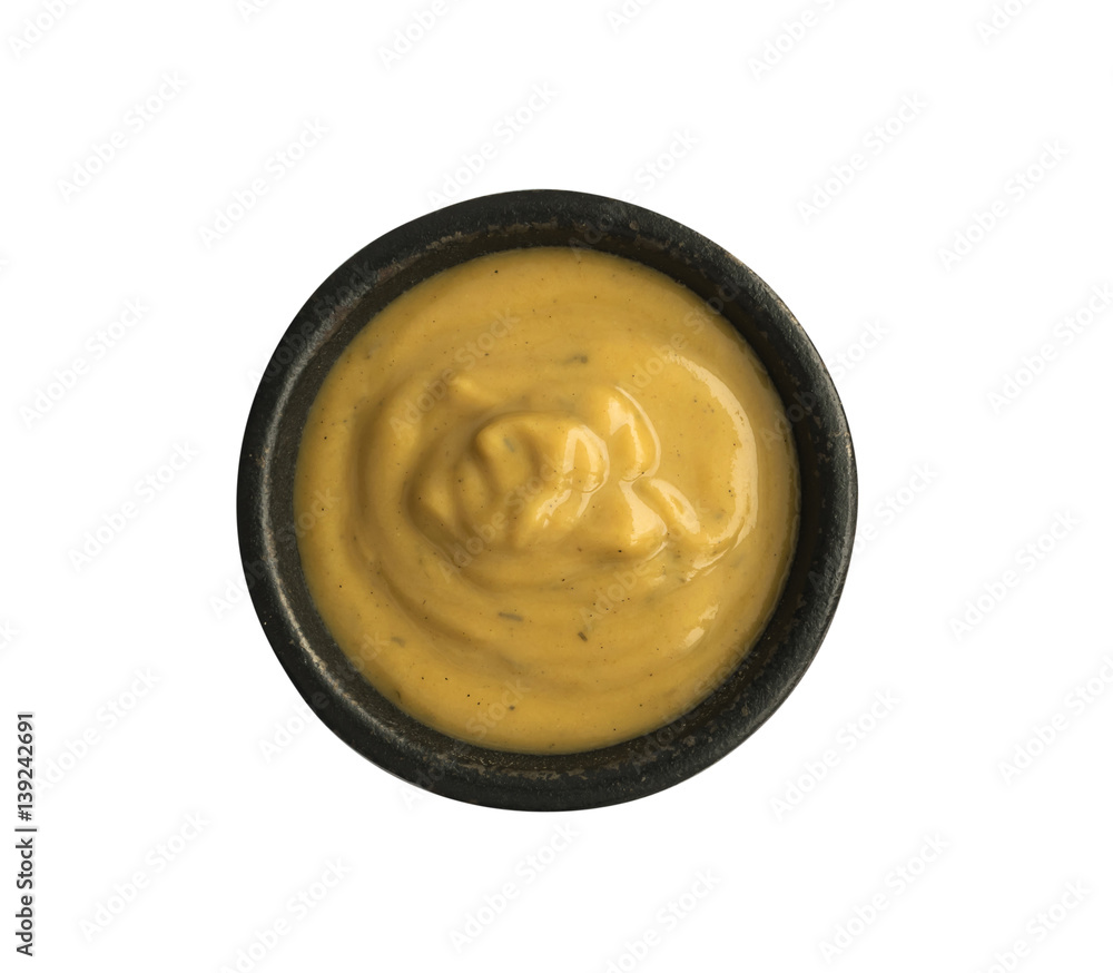 Mustard Sauce in Round Black Bowl Isolated on White Background Mustard Sauce in Round Black Bowl Isolated on White Background