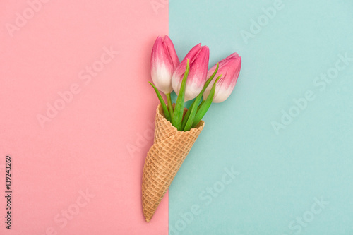 Tulip flowers ice cream waffle cone flat lay Minimal concept photo