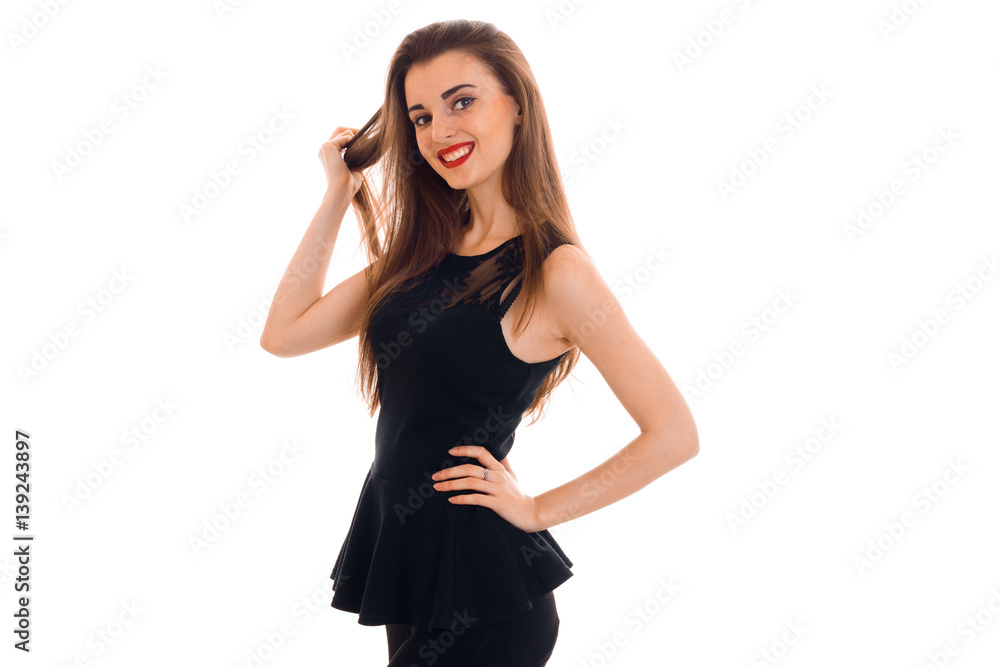 beautiful young girl in a black dress laughs and looks into a camera beautiful young girl in a black dress laughs and looks into a camera