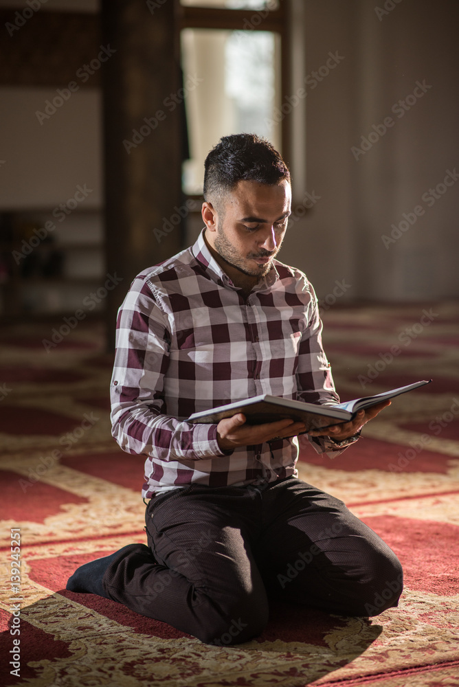 Muslim scholar studying Koran
