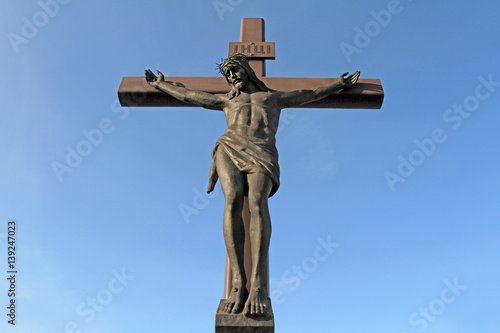 A large crucifix with Jesus Christ in a crown of thorns kolyuchemm open-air view of a close-up right.