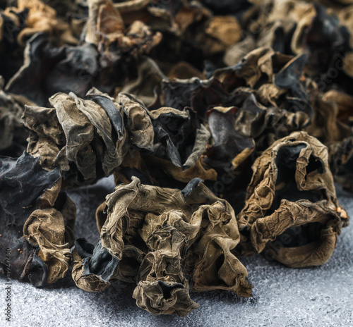 Dry black Chinese mushrooms. Ears. Traditional a popular ingredient for cooking Oriental and Asian cuisine. Selective focus