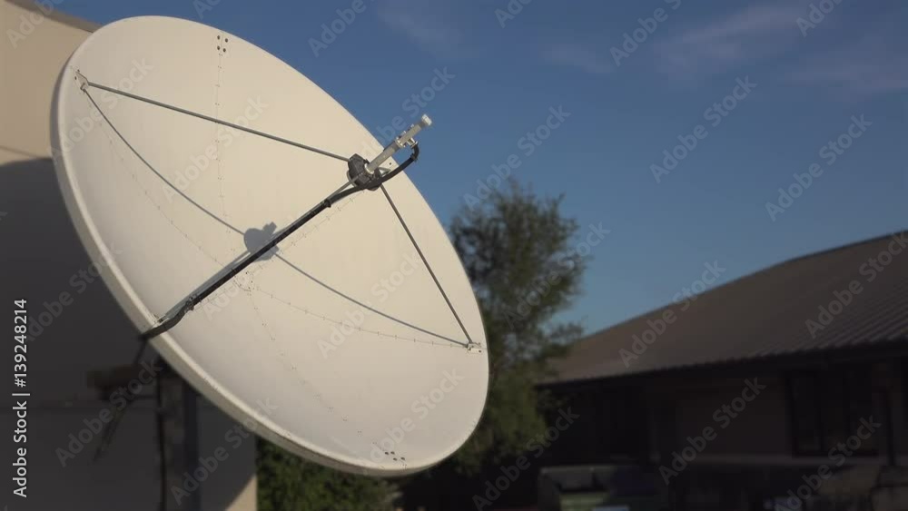 Large Satellite dish outside of radio station.
Large Satellite dish outside of radio station.
