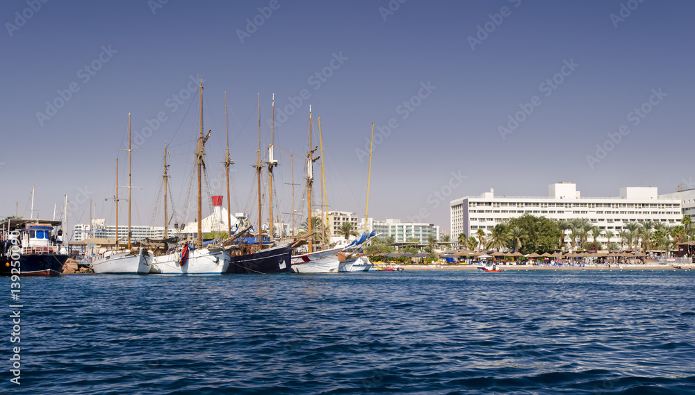 Moored pleasure boats, sailboats and yachts in marina of Eilat - famous resort and recreation city in Israel