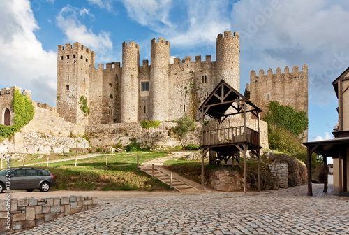 Castle in Obidos, Portugal. Well-preserved example of medieval architecture. Famous touristic place of interest. Medieval fortress with towers.