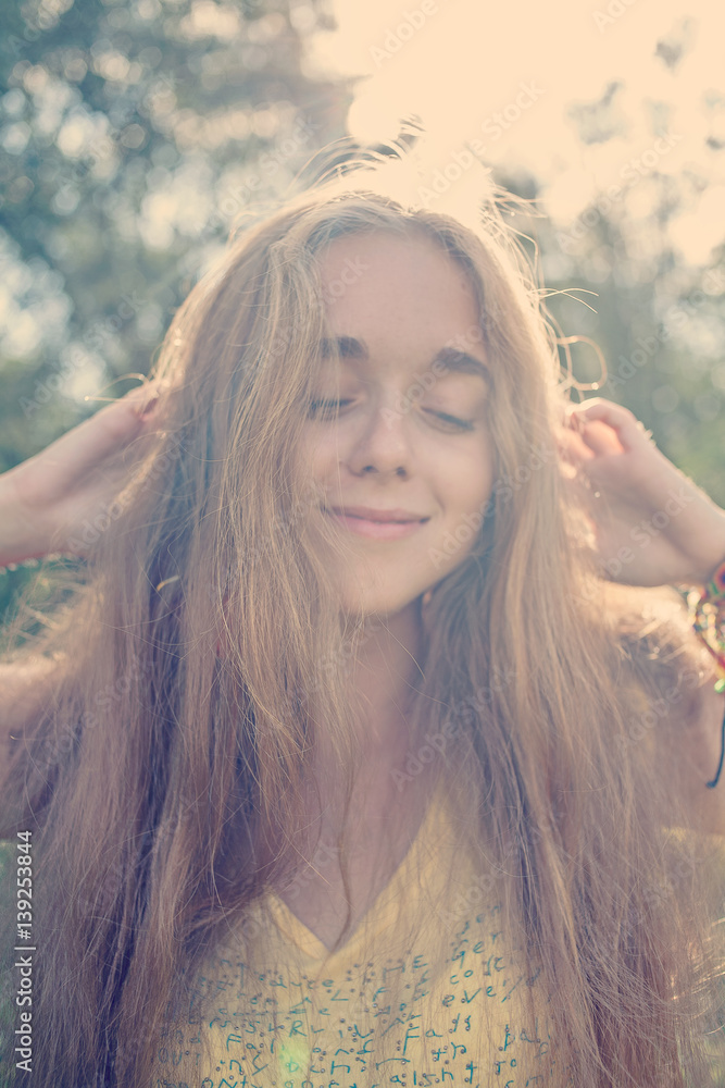 Defocused photo of happy smiling girl her eyes closed retro color Defocused photo of happy smiling girl her eyes closed retro color