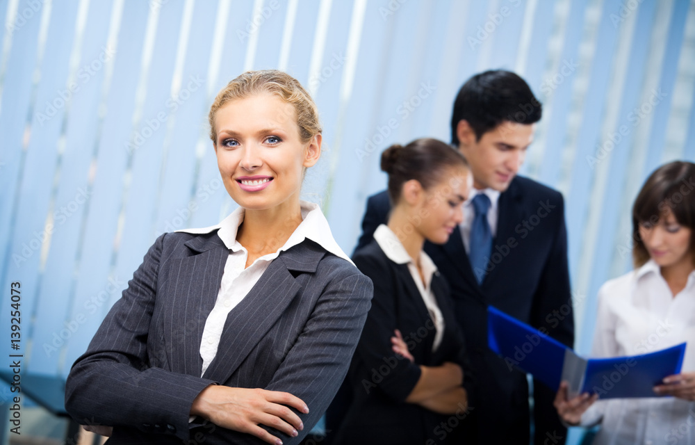 businesswoman and colleagues at office businesswoman and colleagues at office