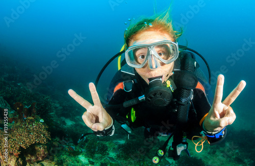 Happy SCUBA diver underwater