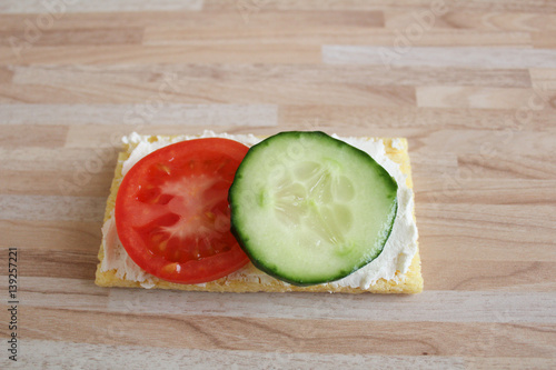 Cottage cheese, corn cracker, tomato and  cucumber