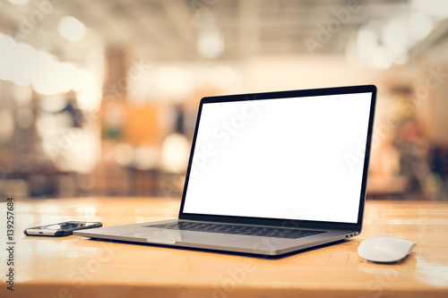 Wallpaper Mural Laptop with Blank Screen on Wooden Table in Bright Modern Workspace – Office Mockup Torontodigital.ca