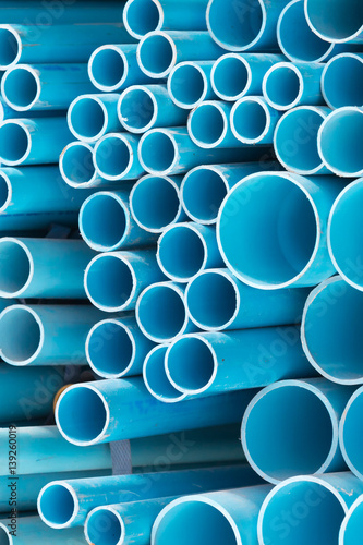 Blue plastic pipes vertical shot
