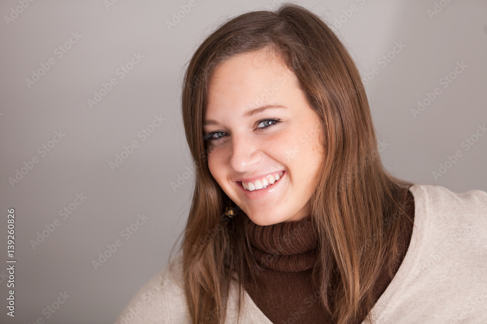 Smiling young girl wearing turtleneck Smiling young girl wearing turtleneck