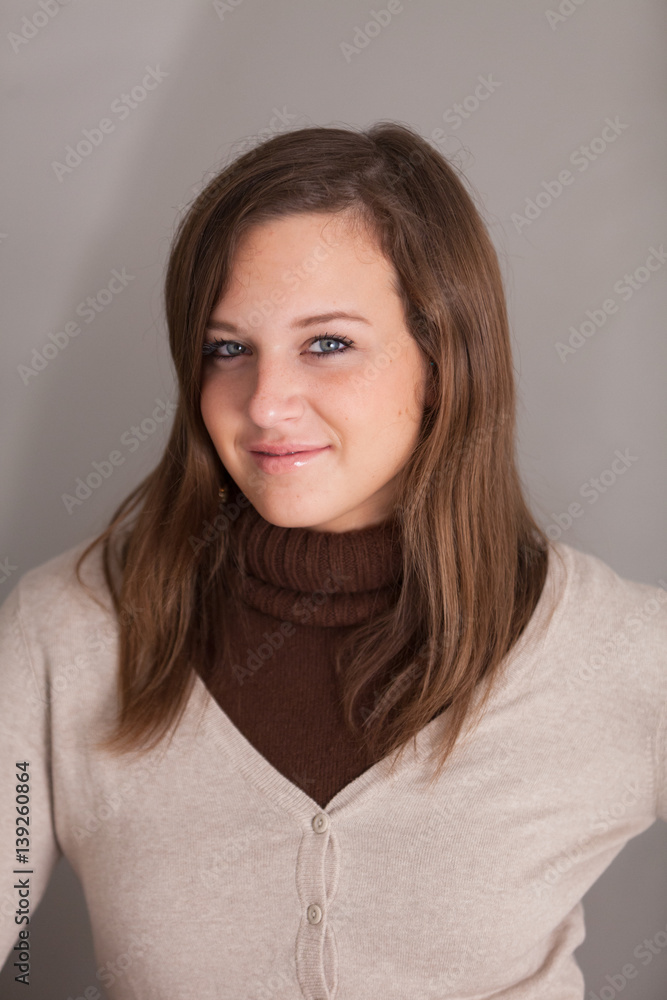 Fototapeta premium Portrait of beautiful and cheerful smiling girl