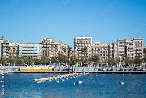 BARCELONA, SPAIN - FEBRUARY 12, 2014: A view to a pier with yachts at Barcelona port, Catalonia, Spain.