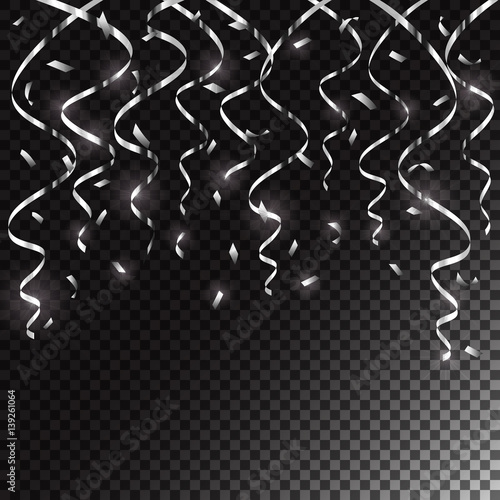 Silver holiday tinsel and confetti on dark transparent background
