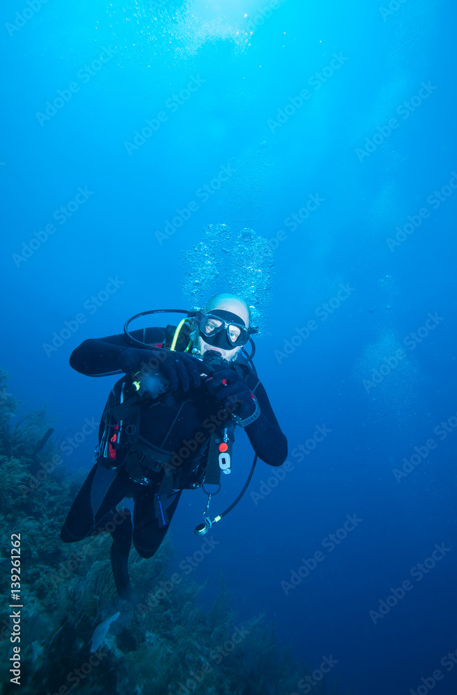 Happy young scuba diver