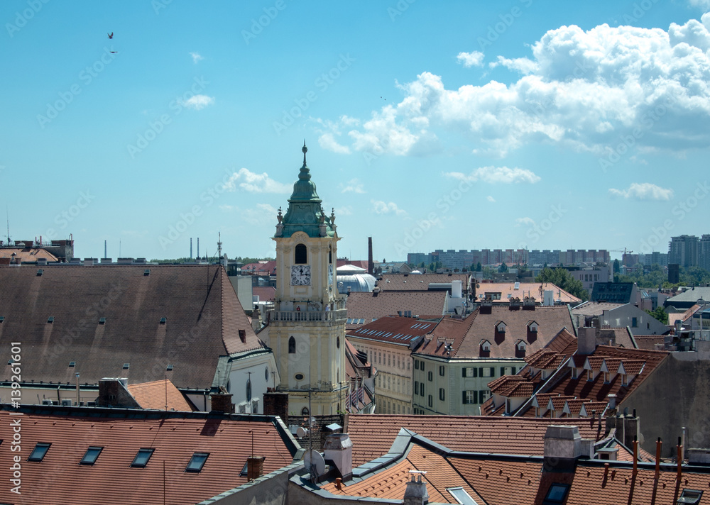 Panoramic view over the roofs of Bratislava (Slovakia) to old town and a church on summer day.