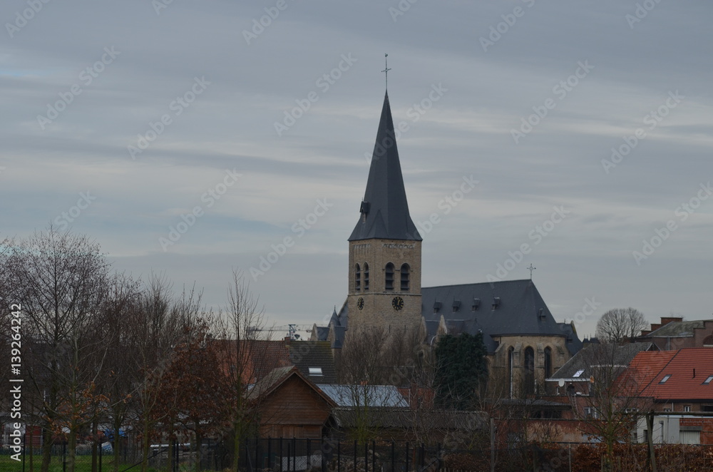 Church and skyline of small Flemish village