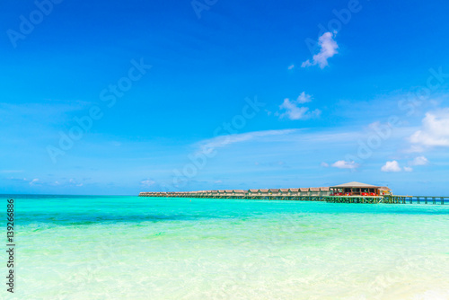 Beautiful water villas in tropical Maldives island .