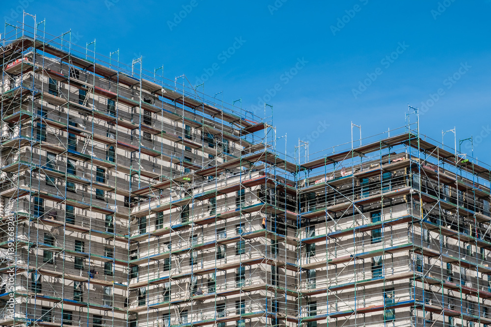 building construction site with scaffolding building construction site with scaffolding