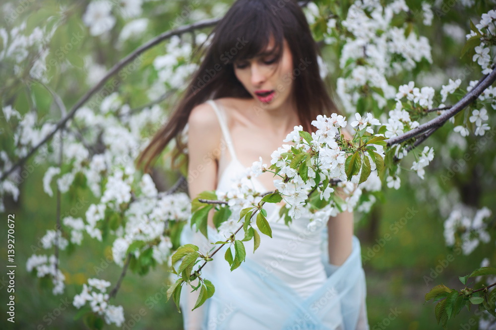 woman in a cherry garden woman in a cherry garden