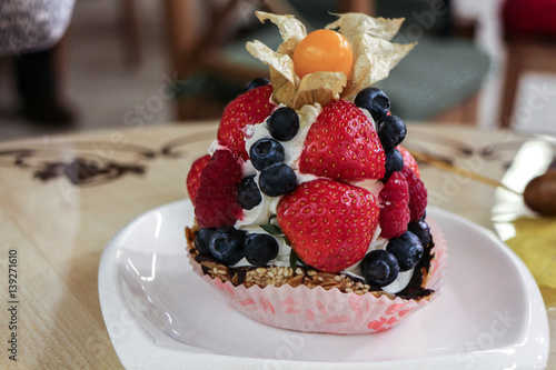 Cake with the berries on the table