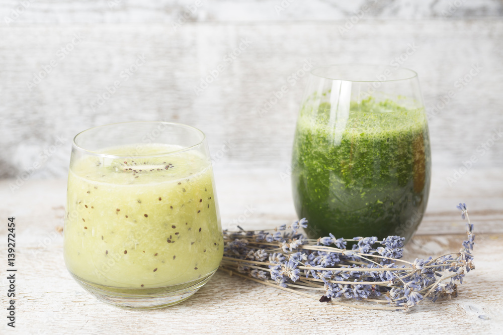 Healthy kiwi smoothie in glass with slice of kiwi and spinach smoothie. Healthy kiwi smoothie in glass with slice of kiwi and spinach smoothie.