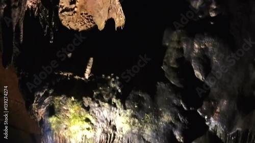 Tourist Shooting Rock Sculptures In Ledenika Cave, Bulgaria photo