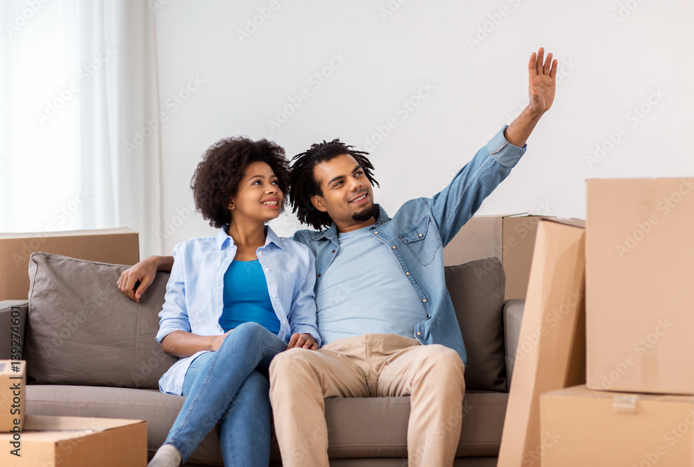 happy couple with boxes moving to new home happy couple with boxes moving to new home