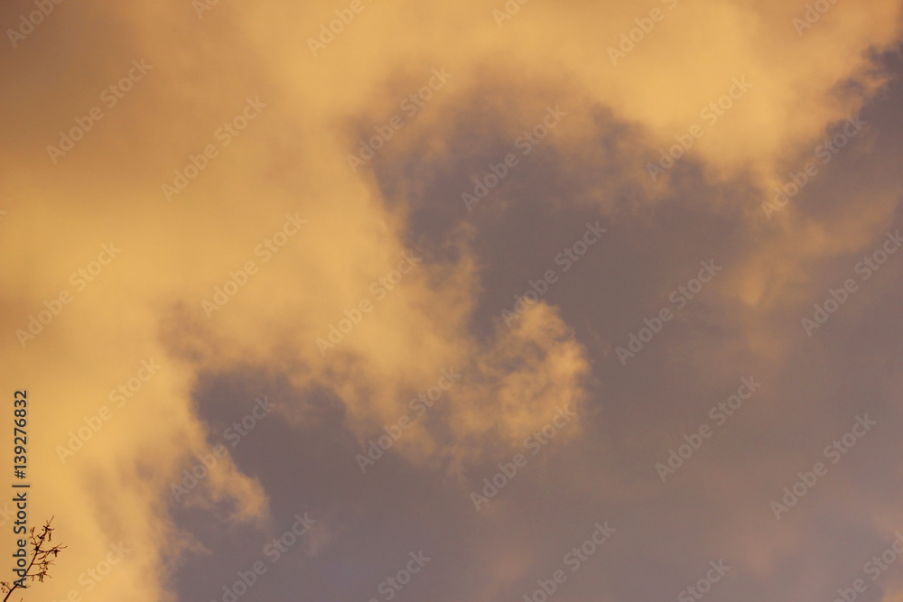 snow cloud painted in gold color of the setting of the spring sun snow cloud painted in gold color of the setting of the spring sun