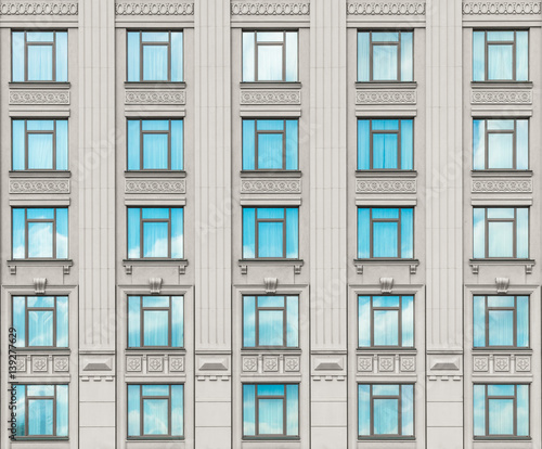 690504 Facade of a modern concrete building with windows