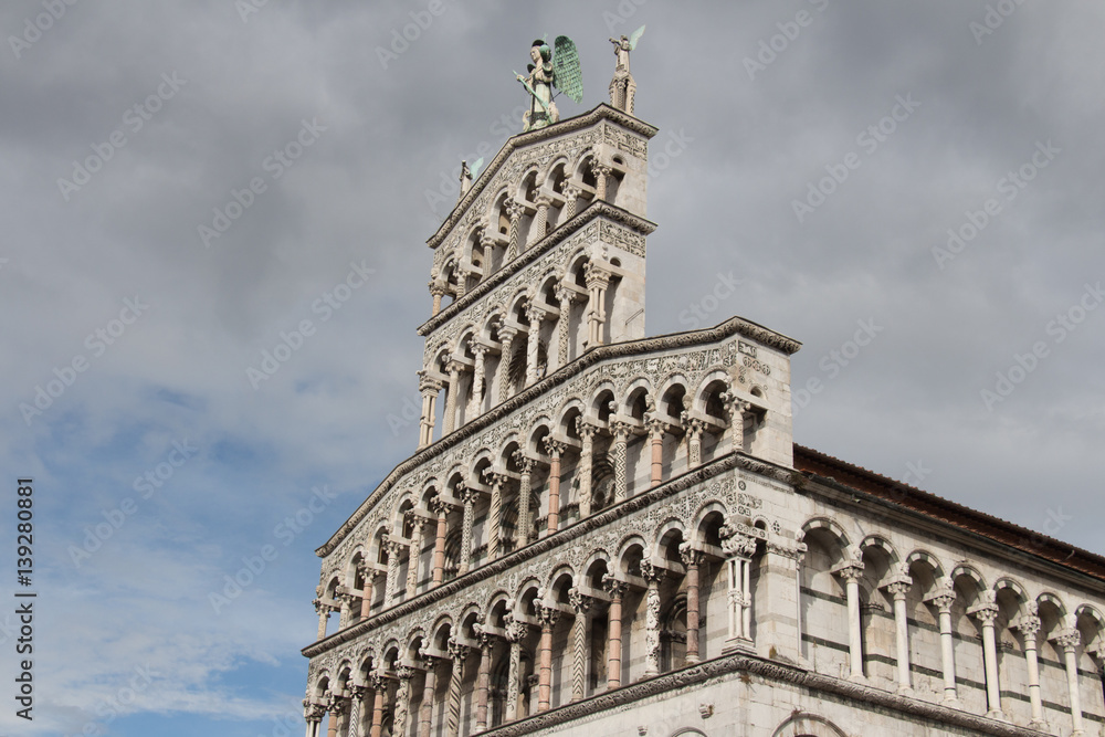 Fragment of facade of San Michele in Foro. Medieval church. Lucca. Italy.