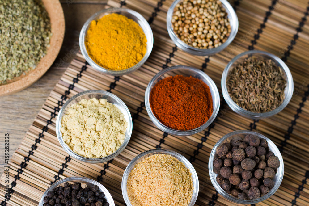 Various fresh spices in bowls, wooden background, Various fresh spices in bowls, wooden background,