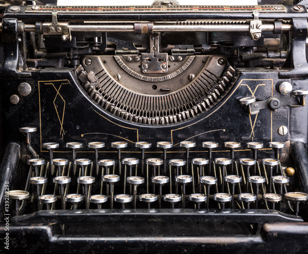 Retro grunge black typewriter closeup