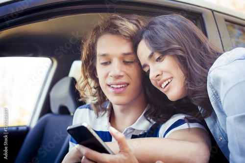 Couple looking at smartphone photo